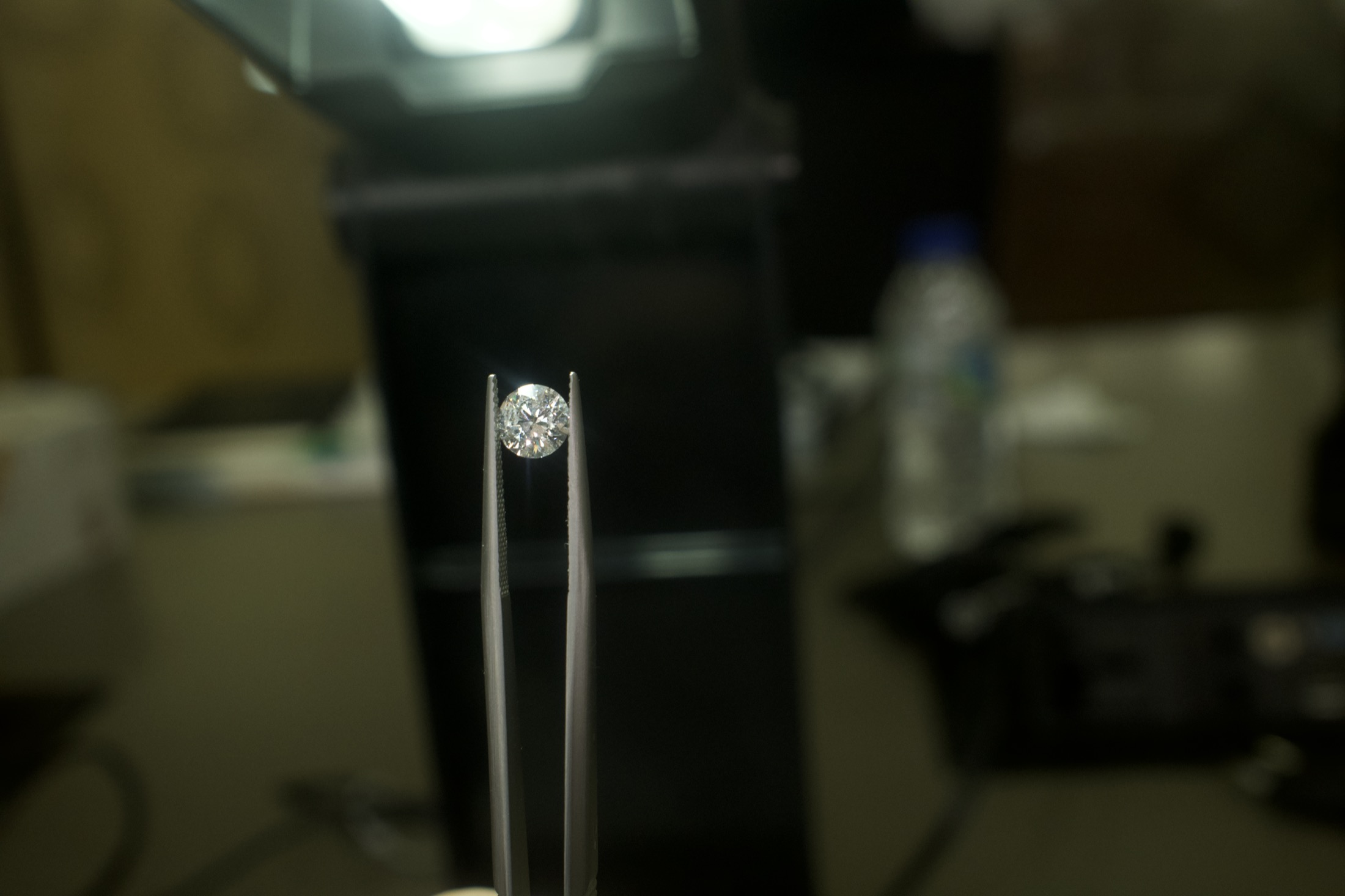 Mirac Demirel inspecting gemstones under stereomicroscope